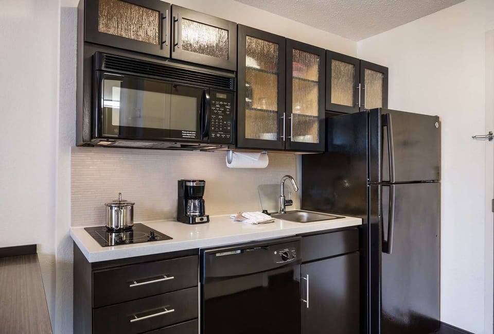 Cook simple favorites with a full fridge and handy cooktop.