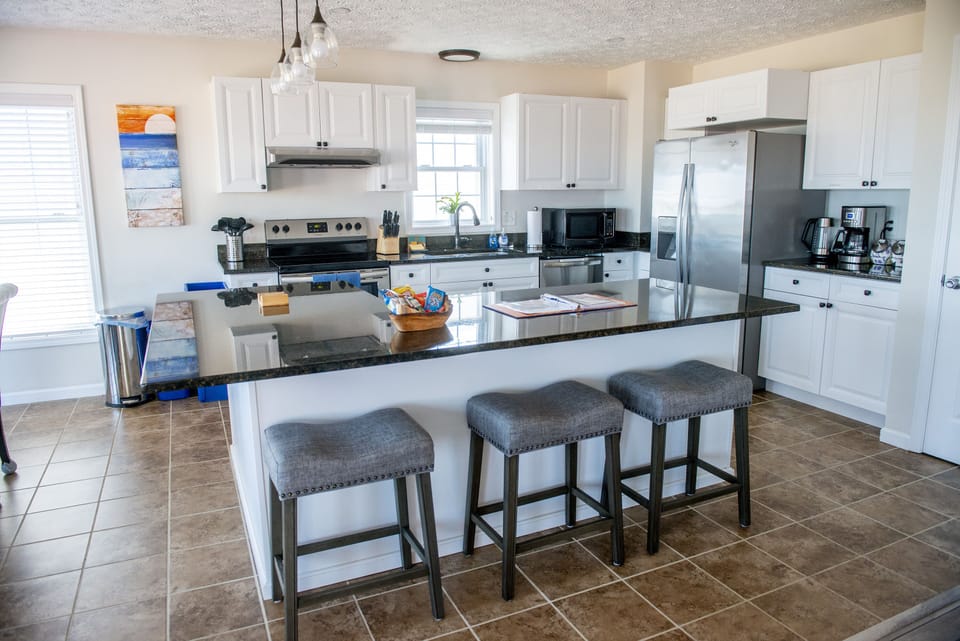 2nd and 3rd floor have identical kitchens w/large island and beach views.