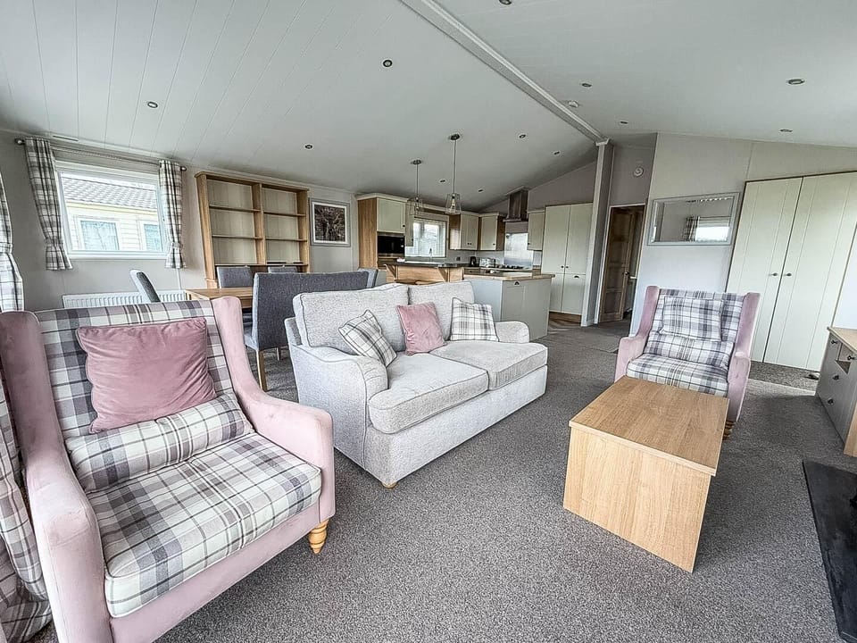 Step inside this holiday home lodge at Manor Park Holiday Park and discover a living area designed for relaxation after a day of exploring Hunstanton.