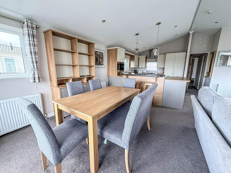 This thoughtfully designed space easily adapts to your holiday needs, whether you're hosting a family games night or enjoying a quiet meal for two.