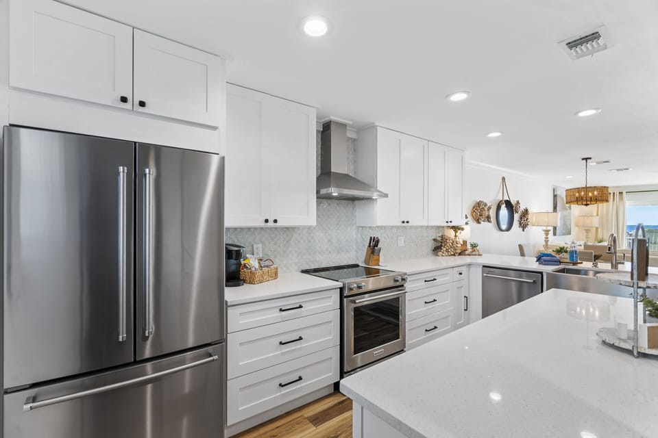 Large Open Concept Kitchen with stainless steel appliances throughout.