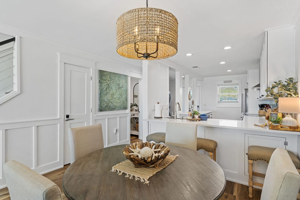 Dining room with view into kitchen.