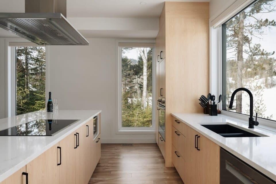 A bright, clean, and spacious equipped kitchen.