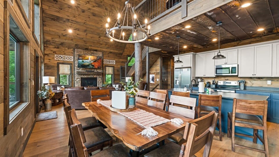 Cook, Eat & watch TV! The dining table seats 8. with four more chairs at the kitchen counter