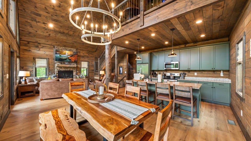 Cook, Eat & watch TV! The dining table seats 8. with four more chairs at the kitchen counter