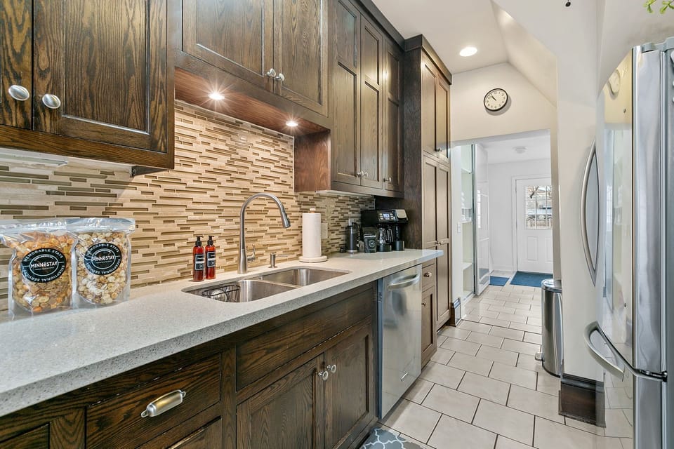 Your fully equipped kitchen features rich wood cabinets, granite counters, and stainless appliances for effortless meal prep.