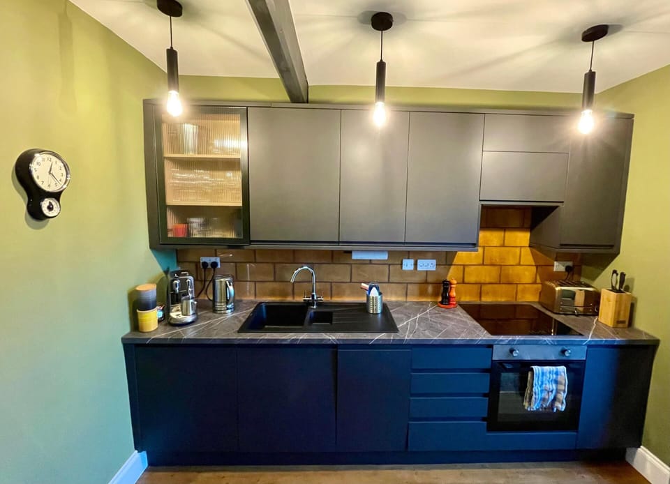 Fully equipped kitchen including oven, fridge and coffee machine