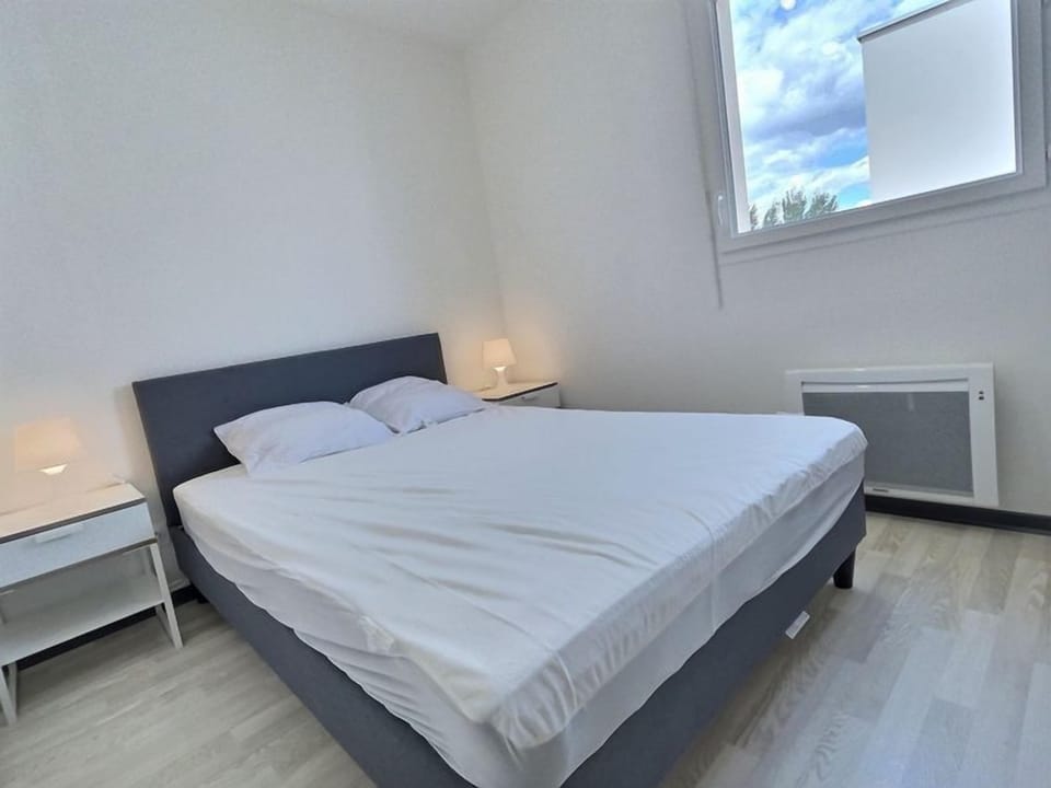 Get a good night's rest in the cozy bedroom.