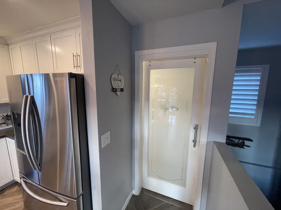 Laundry room with sliding door entry