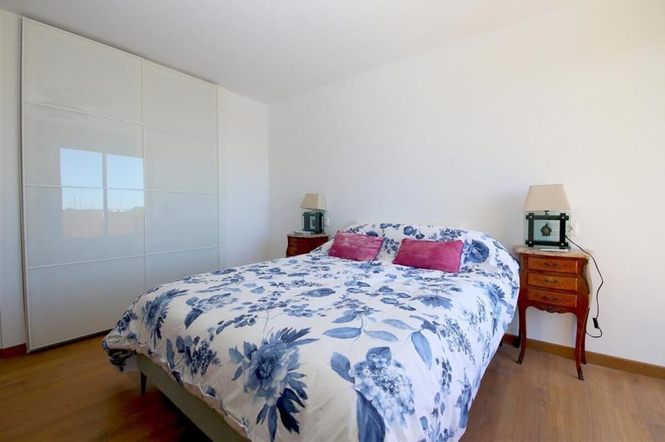 Another view of the second bedroom with built-in wardrobes