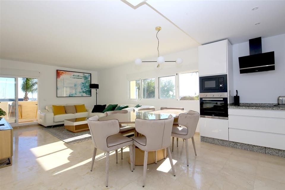 Full view of the lounge and dining area from the open kitchen