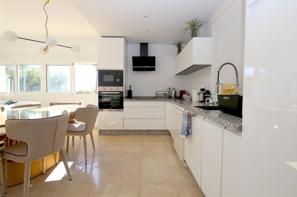Another view of the open kitchen next to the dining area