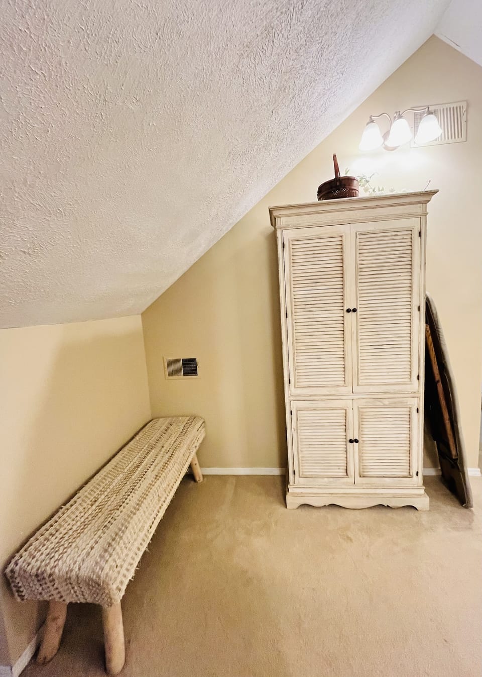 Dressing room. cabinet with towels, etc. walk in closet with hangers & shelves.