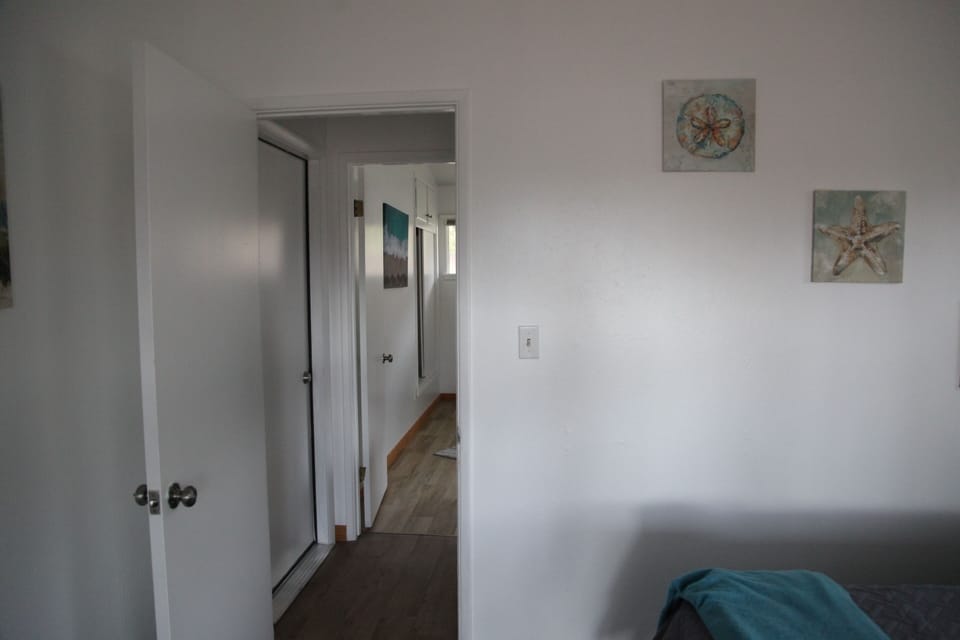 View from bedroom 2 in attached suite to hallway door and kitchenette/lounge. 