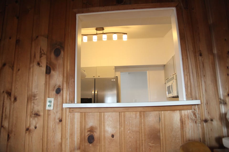 Window from den/office to kitchen.