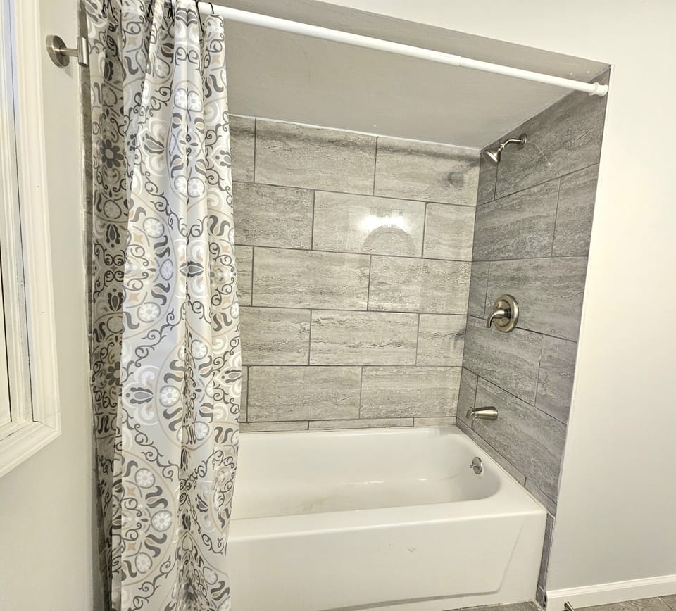 Tub and shower in full bath upstairs