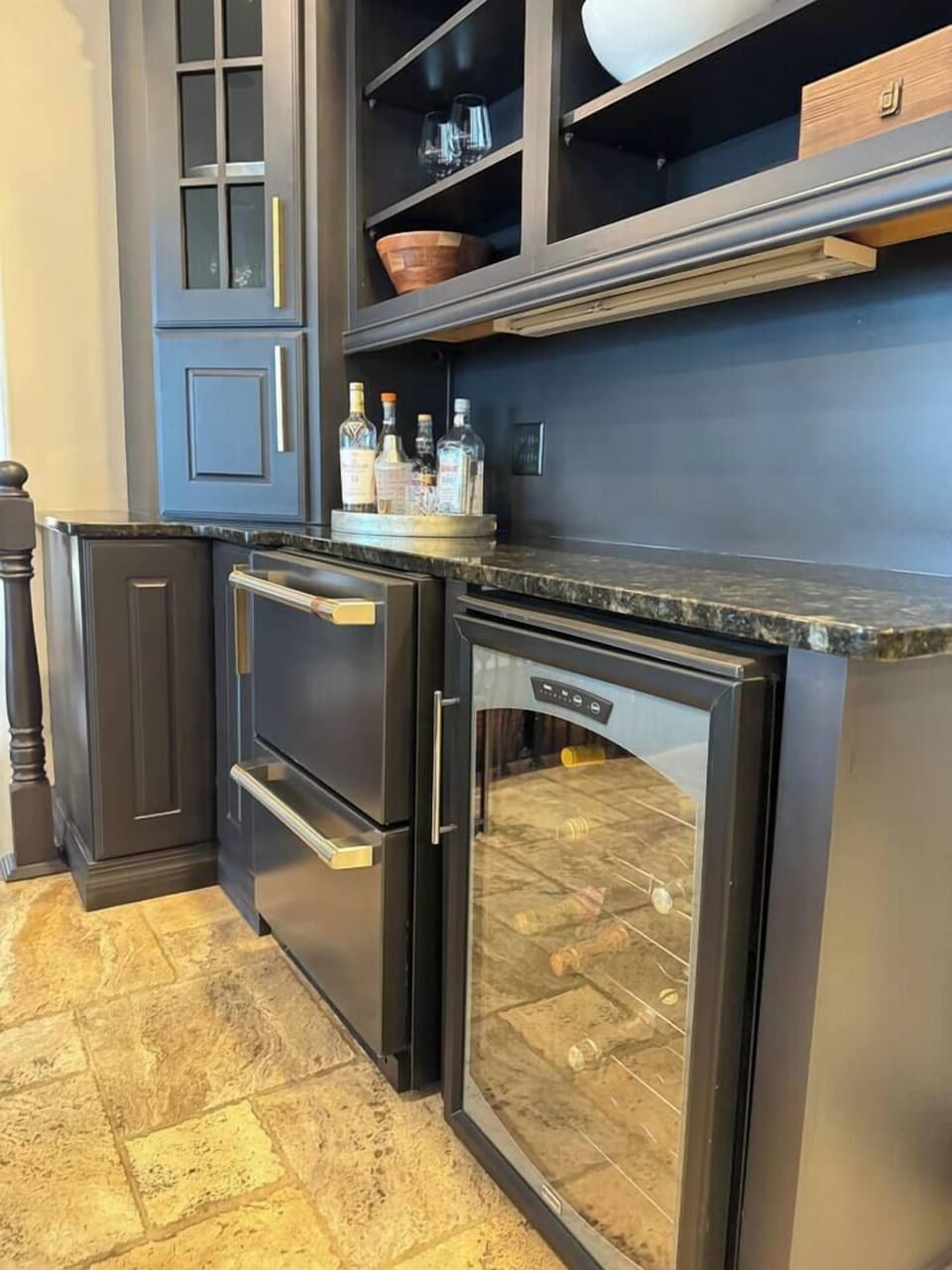 Bar has wine cooler, and two beverage drawers for drinks