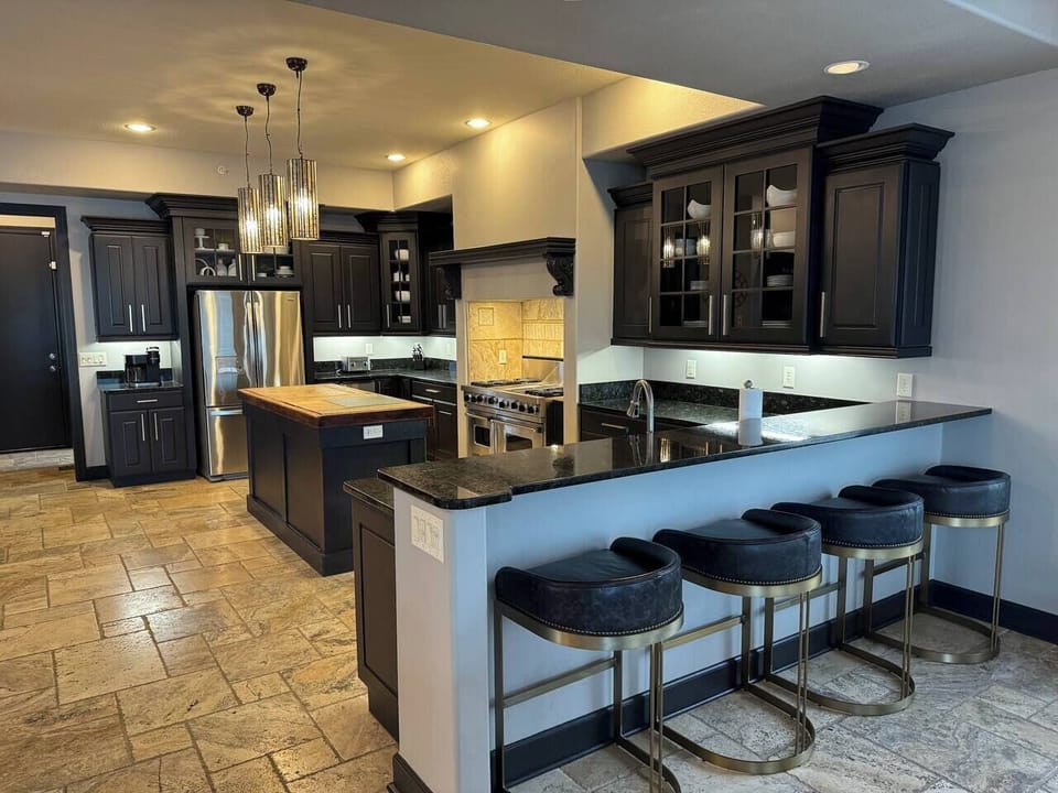 Large kitchen, bar seating and plenty of space for the family.