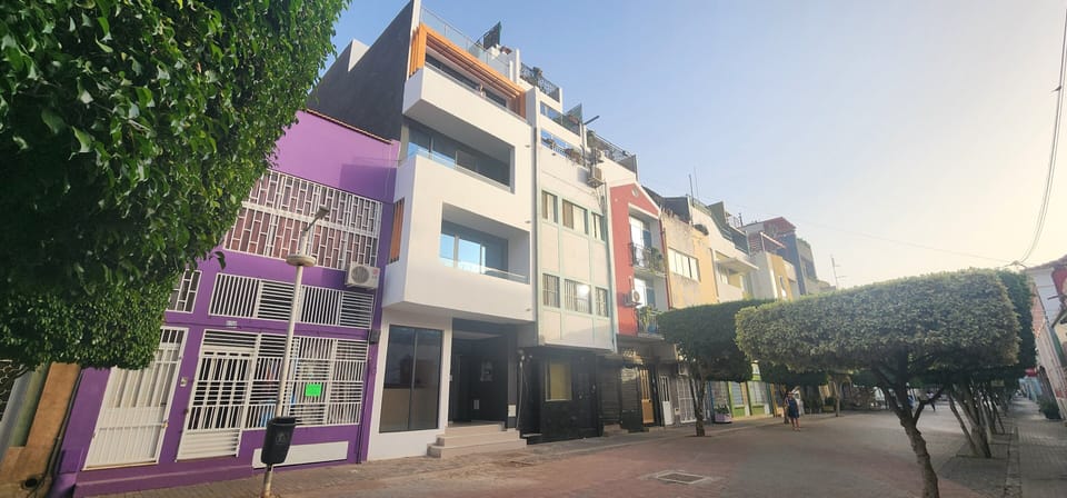 Plateau Neighborhood in City of Praia. apt on Rua Pedonal's tree covered street