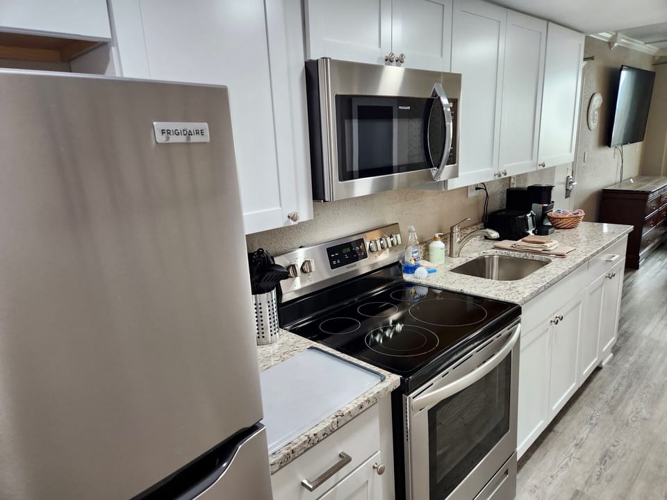 Full size stainless steel kitchen appliances.