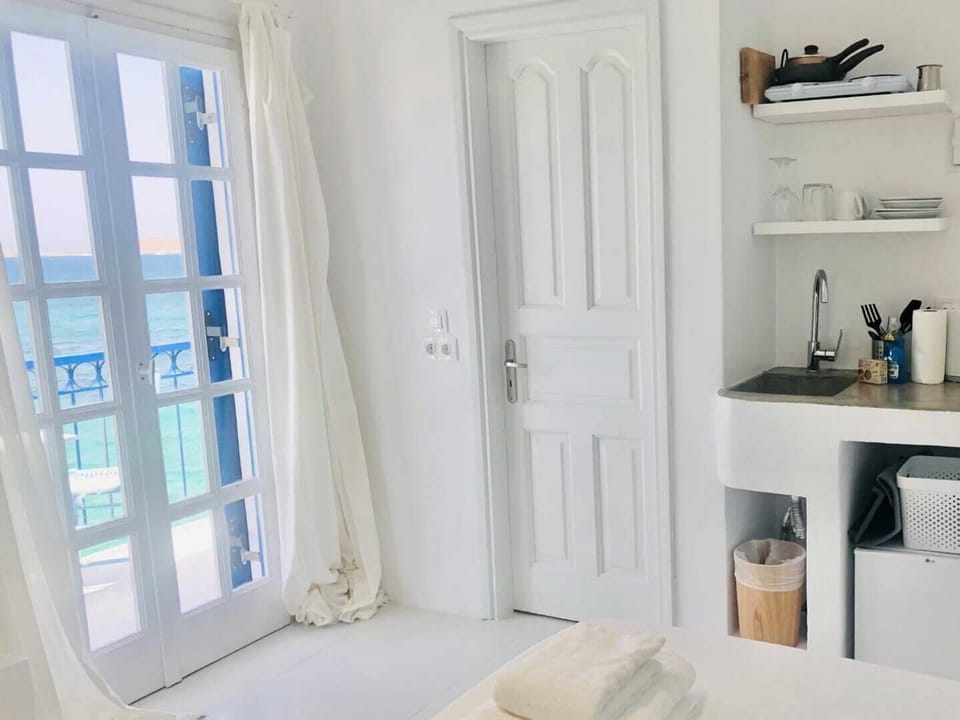 The kitchenette of Casa Stheno, a seafront studio in Naoussa Paros. 