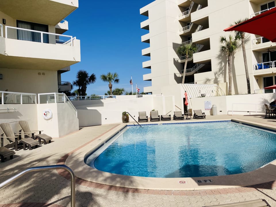 Pool with chairs and umbrellas