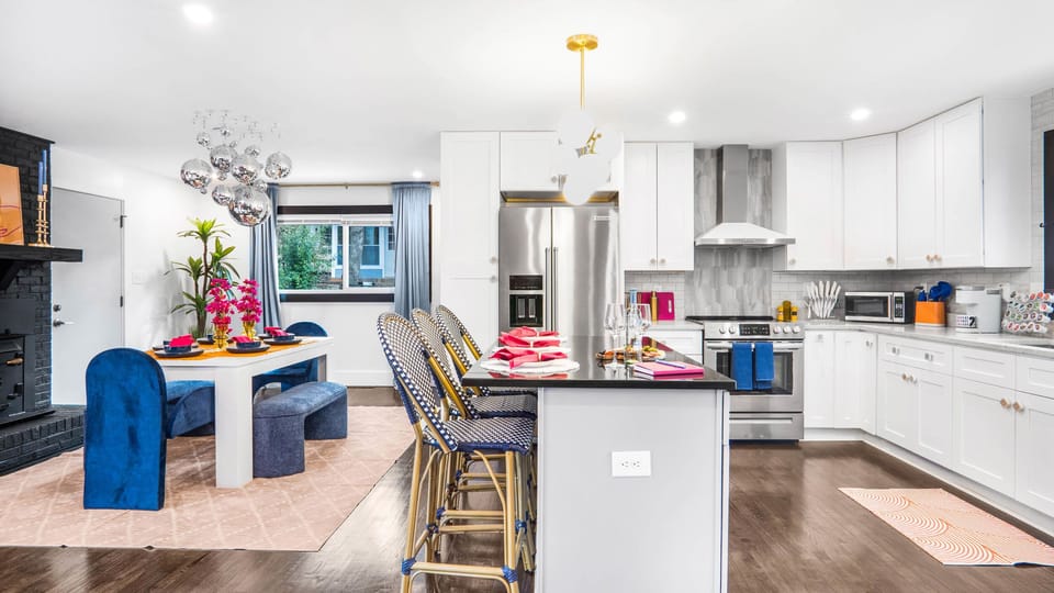 Sleek kitchen and dining area for gourmet conversations.