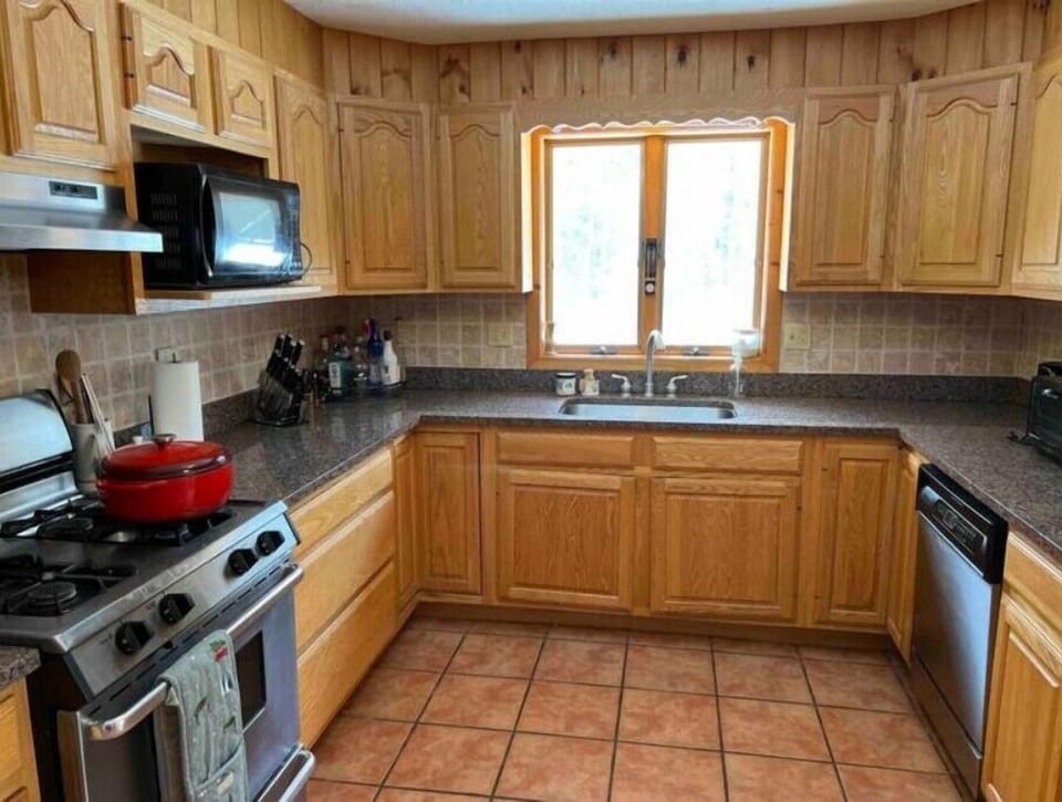 A full kitchen with all cooking supplies and spices.