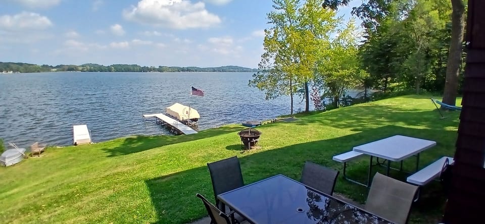 Patio/lakeside area with guest dock