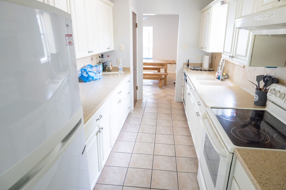 Kitchen with refrigerator and plenty of counter space