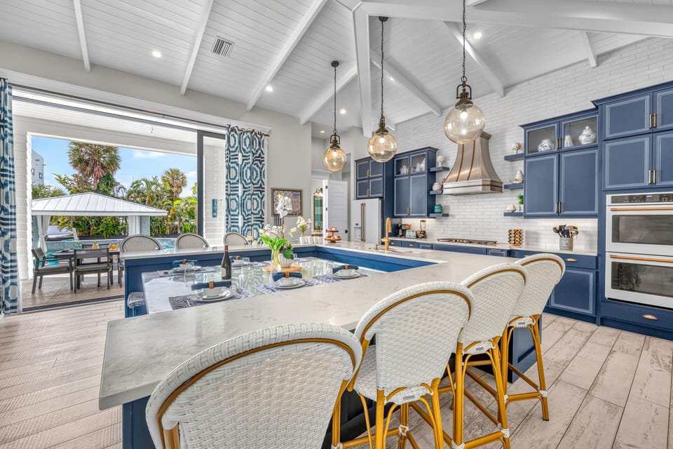 Designed for both everyday ease and entertaining, with views of the pool.