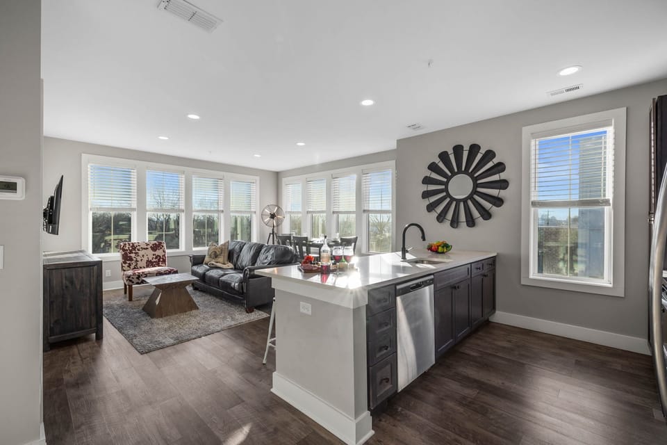Fully equipped kitchen stocked with your basic cooking essentials, stainless steel appliances, and breakfast bar seating.