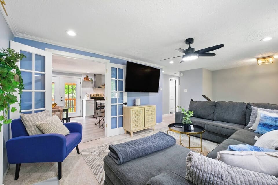 Cozy corners, ample space, and a TV create the perfect spot for fun or relaxation.