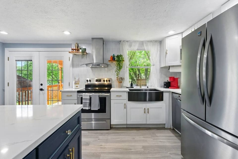 Spacious and clean — a white kitchen designed for comfort and convenience.