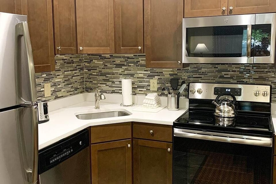 Full kitchen with oven and full stove available in some condos, while others have a well-equipped partial kitchen. Requests can be made but are not guaranteed.