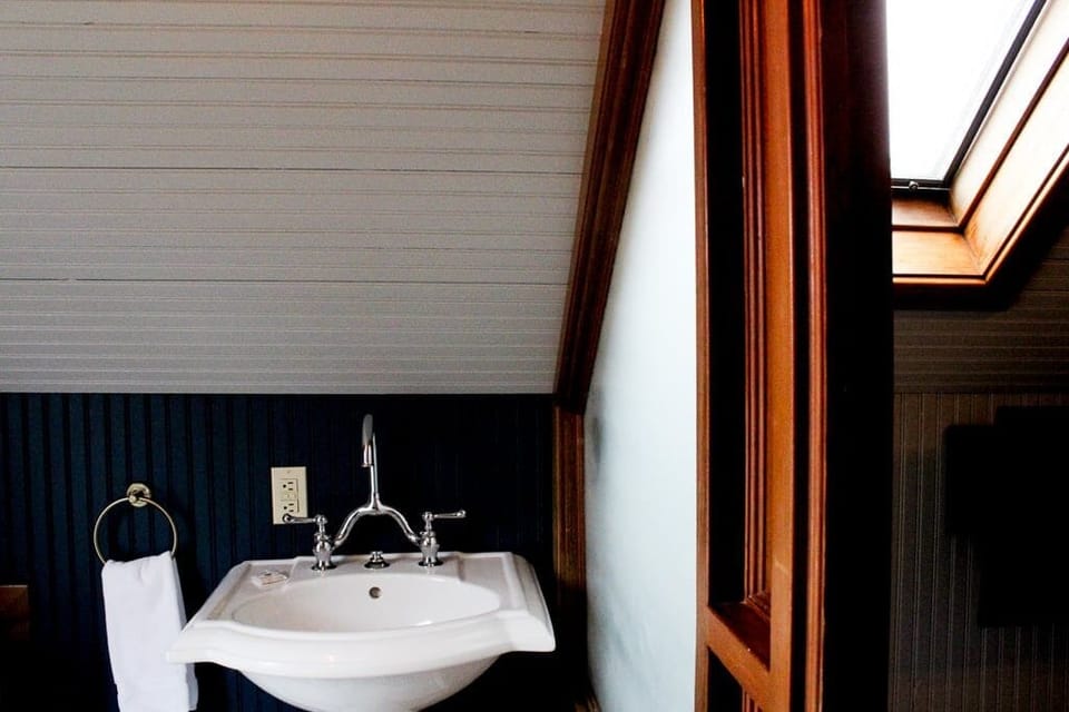 Refresh beneath the skylight at this charming, compact vanity.