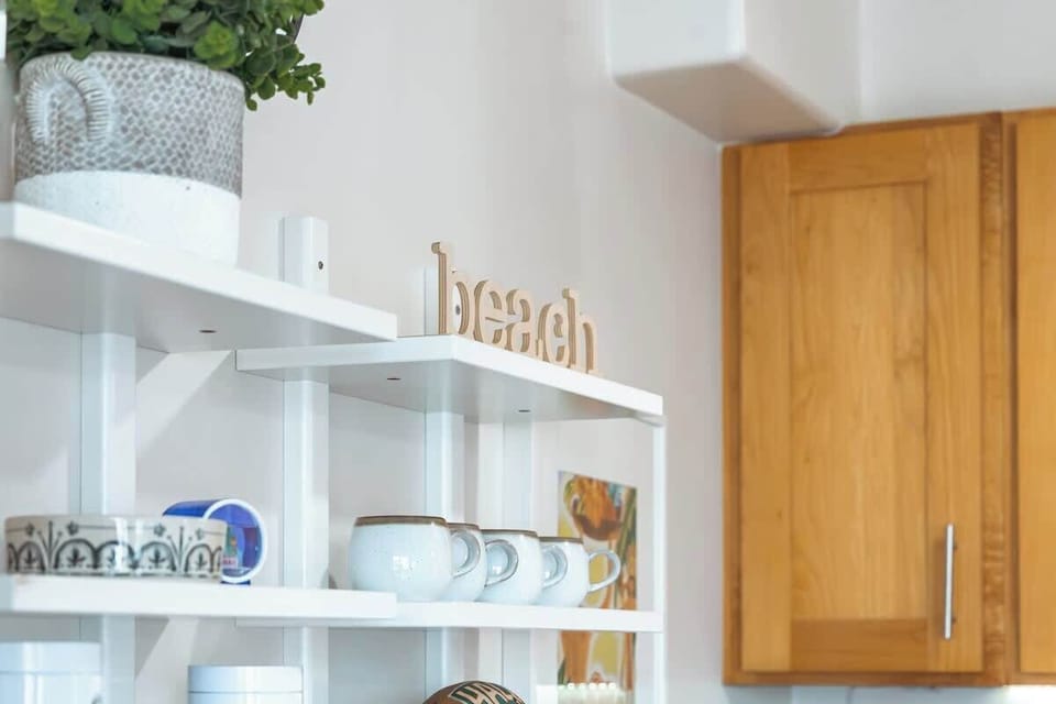 Shelves with other kitchen utensils.