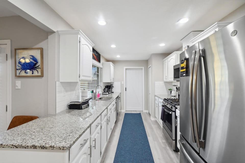 This fully equipped gallery-style kitchen has everything you need to whip up a tasty home-cooked feast, including a coffee machine, blender, toaster, and more!