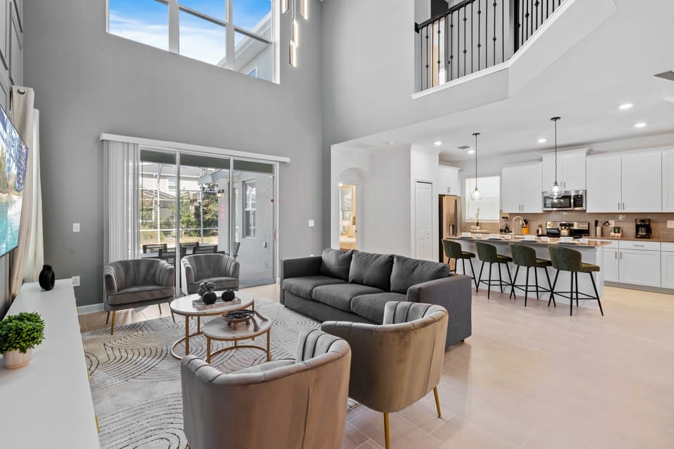 Spacious Living Area of the Home in Davenport Florida - Experience the epitome of elegance in living area - Every detail is curated for a luxurious and indulgent escape  - Smart TV and Netflix - Access to outdoors with pool and seating