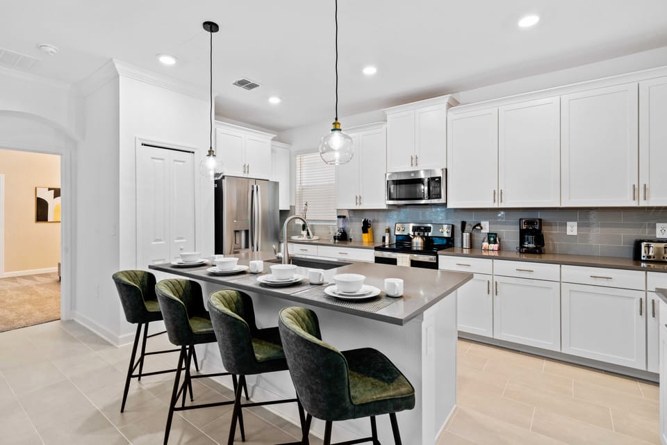 Magnificent Kitchen of the Home in Davenport Florida - Breakfast bar with high chairs - Sleek, stainless steel appliances - Fully Equipped