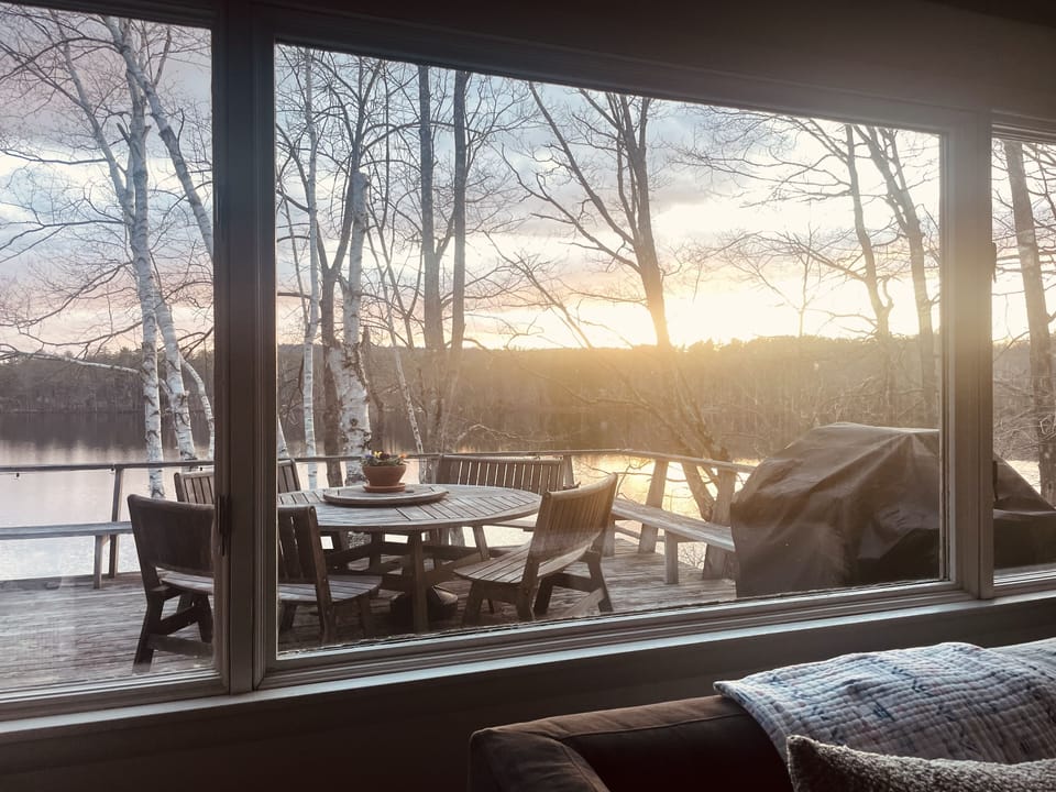 Winter view from the living space of the deck and pond.