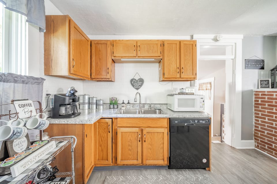 Large country kitchen with all kinds of gadgets and cooking utensils. 