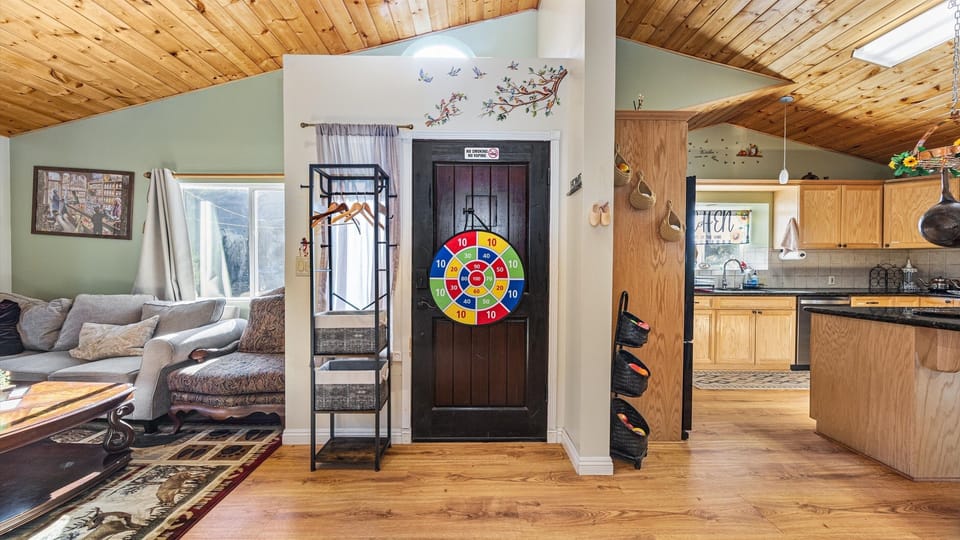 Large windows flood the living room with natural light and frame truly breathtaking views.