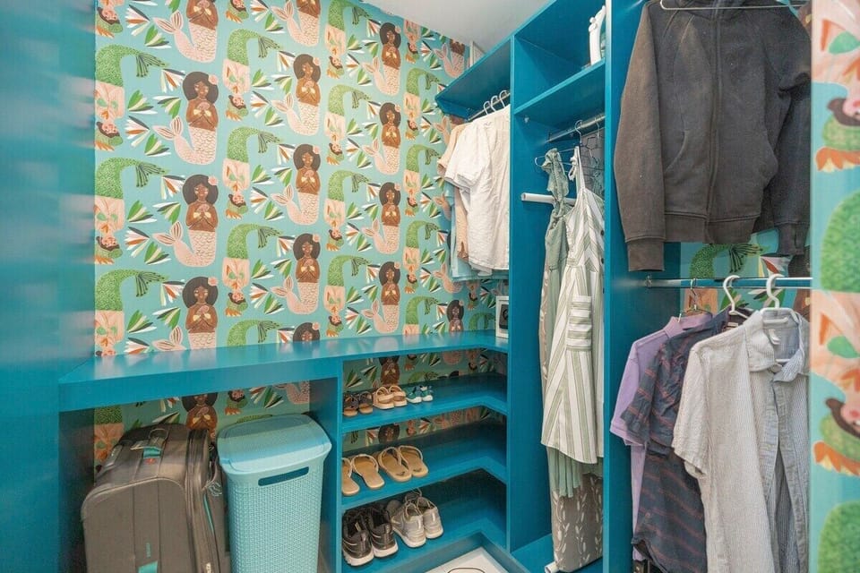 The primary bedroom walk-in closet has lots of storage and hanging space, as well as a safe for your valuables.  