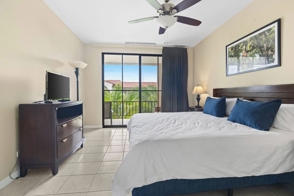 The primary suite has a King bed, luxe wood furniture and a large ensuite bathroom.  