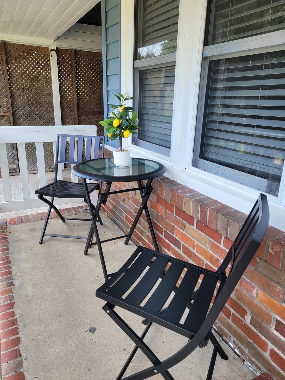 Small seating under the covered front porch