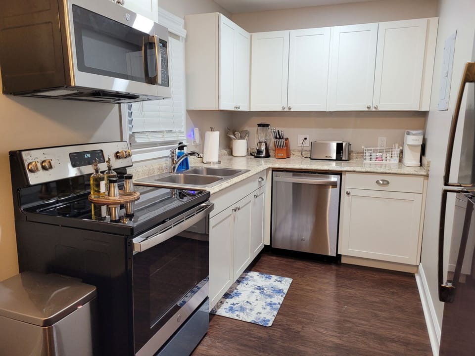 Kitchen with new appliances. Provide starter dish soap, sponge, paper towels. 