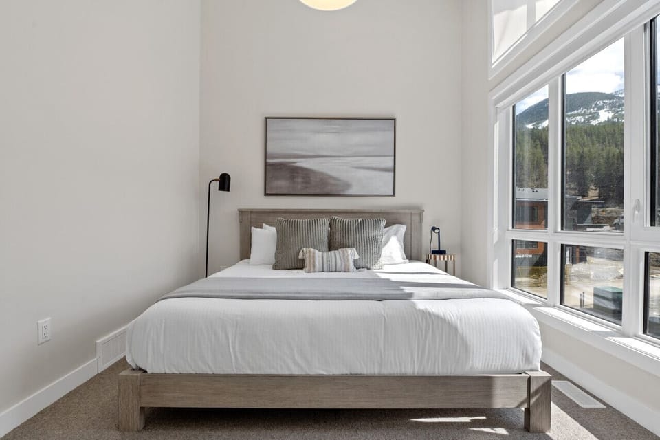 Second bedroom (located upstairs) with a king bed, closet & ensuite access to the second full bathroom.