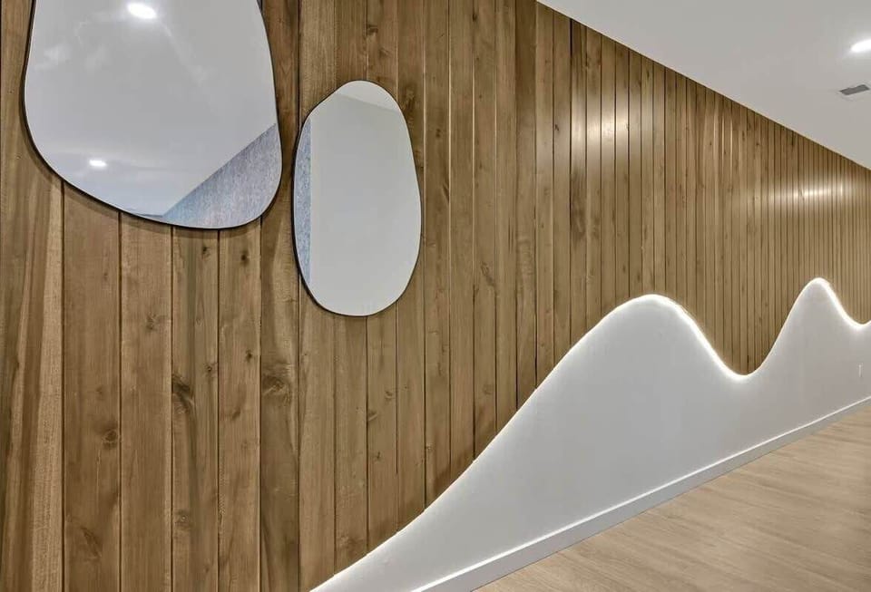 The entrance foyer leads to an open floor kitchen, living room, and dining area.