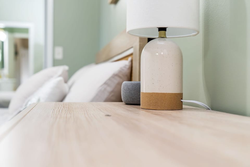 Both bedrooms have alarm clocks with white sound machines.